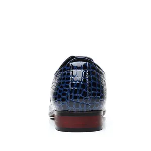 Detailed rear view of blue crocodile embossed patent leather men's fashion dress shoes