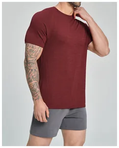 Macro view showing the seamless texture of a burgundy men's breathable sport t-shirt