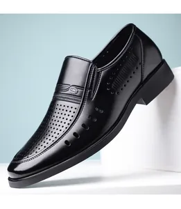 Close-up of black men's business dress shoes with breathable hollow-out leather design