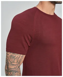Close-up of seamless breathable fabric texture on a maroon men's sports t-shirt