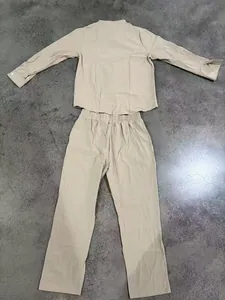 Full layout view of men's tan linen two-piece set showing shirt and long trousers