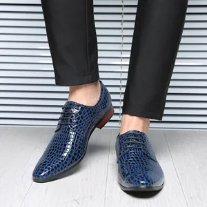 Detail showing blue stone-patterned pointed-toe men's dress shoes with laces