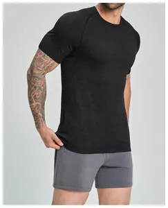 Close-up of black seamless breathable sports t-shirt on athletic male model.