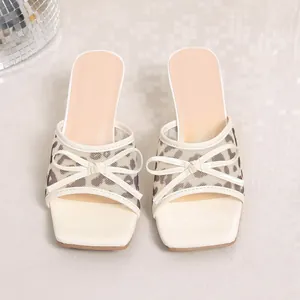 Front view detail showing the leopard mesh and bow on the beige high heel sandals.