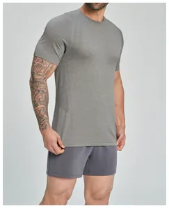 Close-up of men's seamless breathable sports T-shirt showing grey fabric texture.