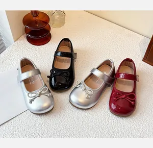 Four pairs of girls' Mary Jane princess shoes in silver, black, and red with bow detail.