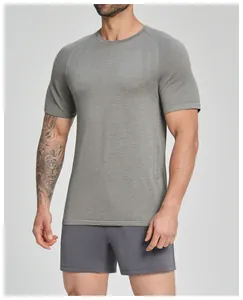 Close-up of men's seamless grey fitness t-shirt with breathable knit texture and athletic fit.