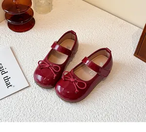 Classic burgundy Mary Jane shoes for girls with bow detail and glossy patent leather