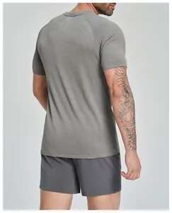 Back view of a grey seamless sports t-shirt for men showing breathable knit texture