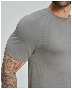 Close-up of seamless breathable grey men's sports T-shirt showing detailed knit texture.