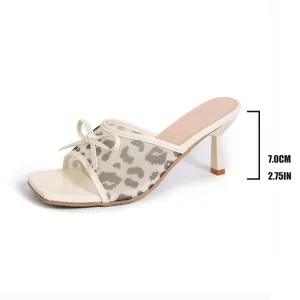 Close-up of elegant leopard print mesh mule sandal with 7cm heel height measurement.