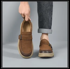 Close-up of vintage brown leather loafers for men with soft sole and buckle detail
