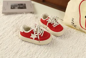 Vintage red children sneakers with white star pattern and thick chunky beige soles