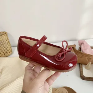 Elegant red patent leather Mary Jane shoes for girls with bow detail and soft sole
