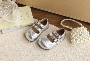Elegant silver metallic girls' princess shoes featuring double buckle straps detail view