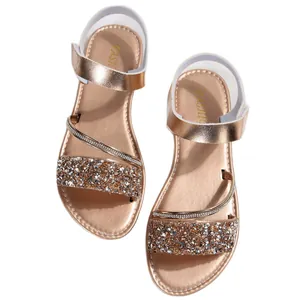 Rose gold flat sandals for women featuring sequin details and adjustable velcro ankle straps.