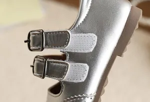 Detail showing double buckle straps and metallic silver finish on girls princess shoes.