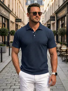 Close-up of navy blue men's polo shirt with textured jacquard pattern in street setting