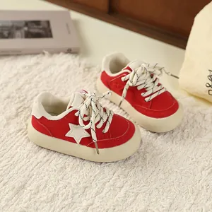 Red retro kids sneakers with white star pattern and chunky soles for boys and girls