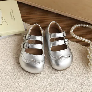 Silver metallic girls' Mary Jane shoes with British style brogue detail and soft sole