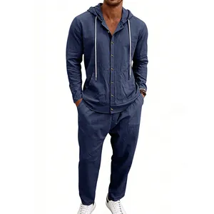 Detailed shot of men's loose linen hooded shirt and matching trousers set in navy