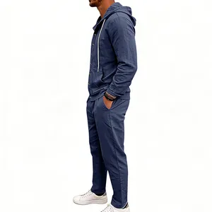 Side view of a men's loose linen-blend two-piece hooded shirt and pants set in navy blue.