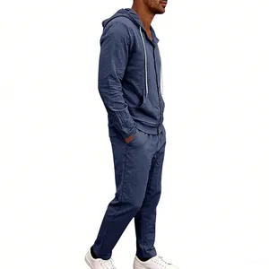 Side view of men's loose linen hooded long-sleeve shirt and trousers set in navy blue