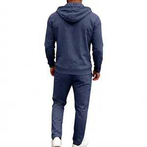 Rear view of men's casual blue linen two-piece set featuring a hooded shirt and long pants