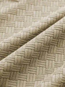 Close-up macro detail showing the breathable jacquard knit texture on casual men's polo shirt