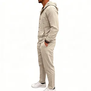 Side view of a men's loose linen hooded long-sleeved shirt and pants set in beige.