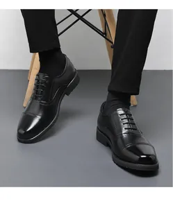 Detail shot of men's black cap-toe oxfords, highlighting the square toe and leather shine.