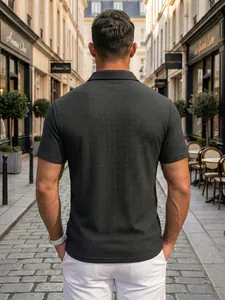 Back view detail of men's dark textured polo shirt with intricate basketweave pattern