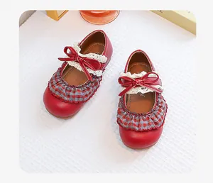 Retro red girls' Mary Jane shoes featuring plaid ruffle, white lace, and bow detail
