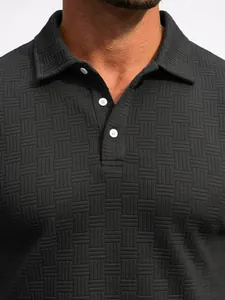 Macro view of a black men's polo shirt featuring a unique jacquard woven texture.