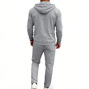 Detail view of the back of a casual grey linen hoodie and trousers set for men