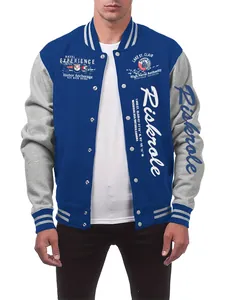 Detailed view of the varsity jacket's white script embroidery and navy fabric.