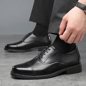 Classic men's black business dress shoes featuring cap toe design and brogue perforations