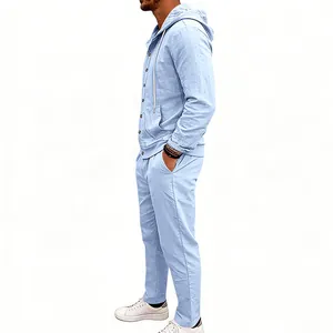 Detailed side view of a men's loose light blue linen hooded long sleeve shirt and pants set