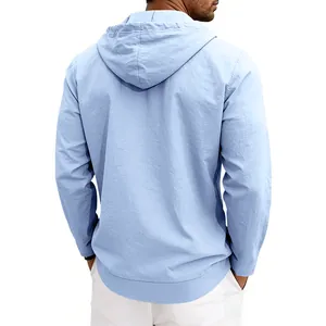 Detailed back view of a light blue men's hooded linen shirt with loose beach style fit