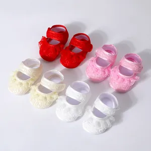 Lace trim baby walking shoes in red, pink, cream, and white with non-slip soles for babies