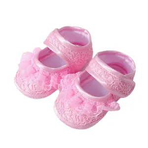 Elegant pink lace baby shoes with ruffle detailing and soft sole for infant pre-walkers