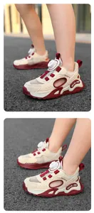 Close-up detail of kids' breathable mesh sneakers with swivel buckle closure