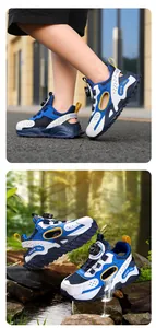 Detail of kids' breathable mesh sneakers with rotary buckle system in nature setting.