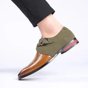 Detail of stylish men's business formal leather monk strap shoes with green suede patchwork
