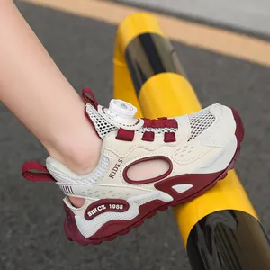 Breathable kids' mesh sports shoes with rotary dial and hollowed-out side design