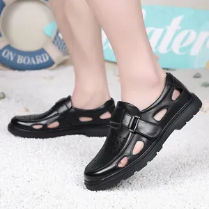 Breathable black leather men's summer sandals with hollow-out design shown on model.