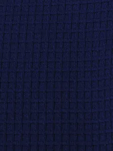 Close-up of navy blue waffle knit fabric for men's Henley T-shirt.