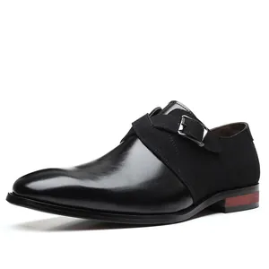 Side view detail of black patchwork monk strap dress shoes with elegant metal buckle