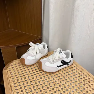 Stylish kids' white retro sneakers with soft soles and non-slip gum rubber outsoles
