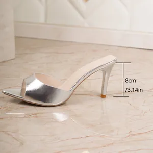 Side view of silver metallic stiletto mule showing 8cm heel height detail
